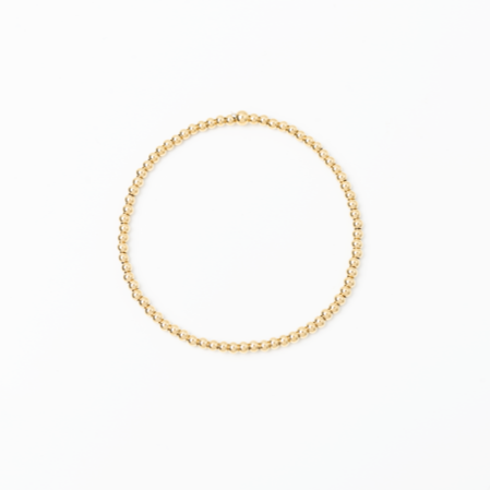 Gold bracelet on a white background