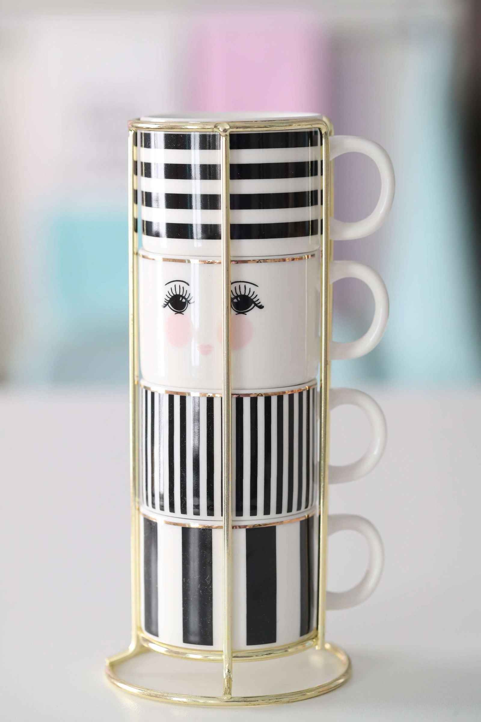 Miss Étoile Espresso mugs in a rack black & white