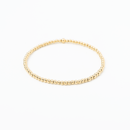 Gold bracelet on a white background