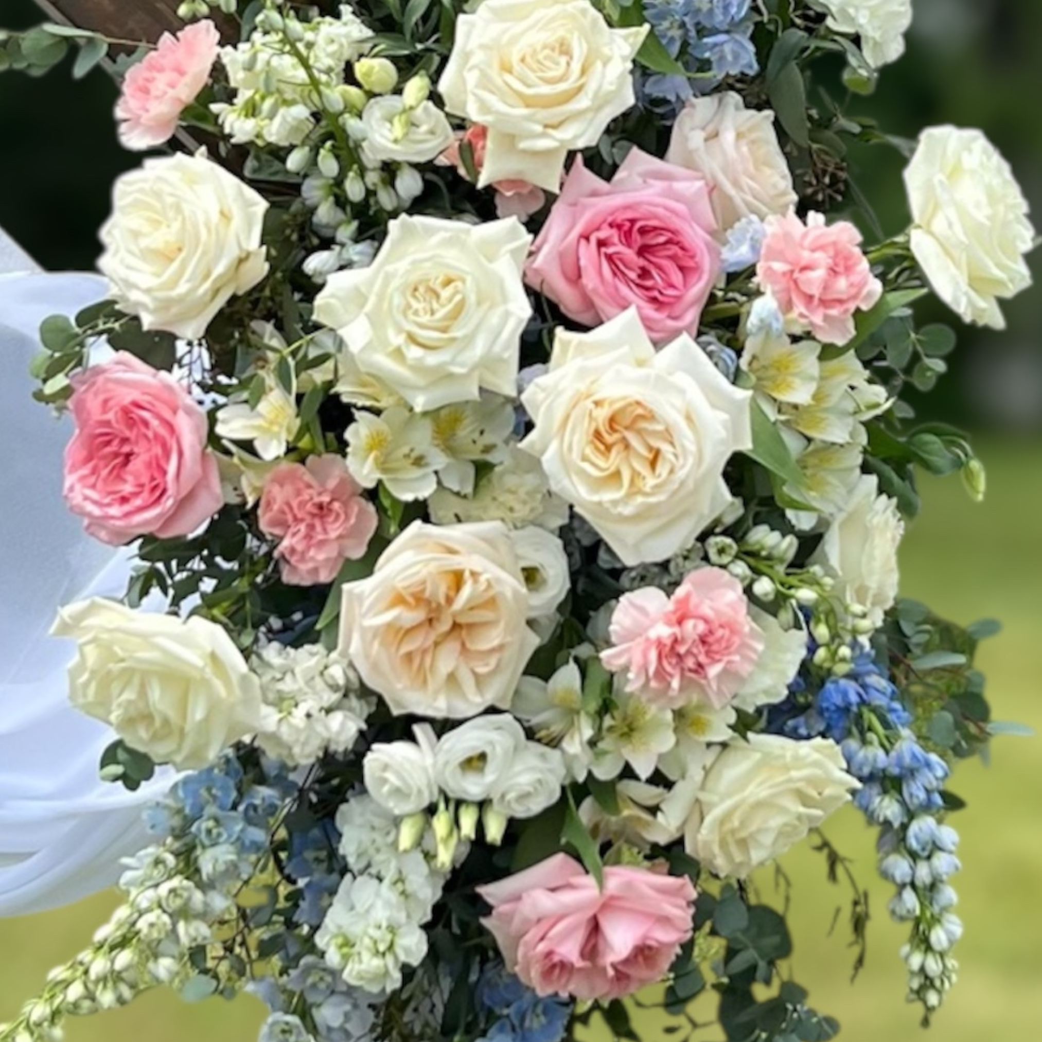 Wedding flowers with white, pink, and green colors on a blurred background