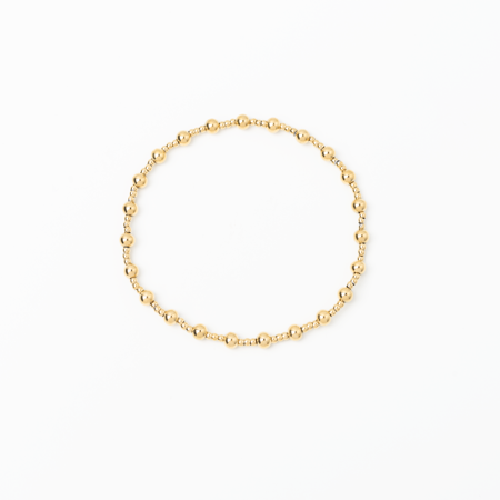 Gold bracelet on a white background