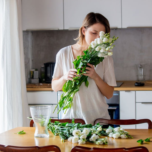 Woman smelling flowers