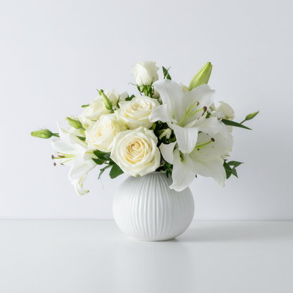 Bouquet of white flowers in a gray vase on a light gray background