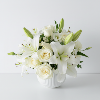 Bouquet of white flowers in a gray vase on a light gray background
