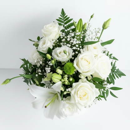Bouquet of white flowers with greenery on a light background