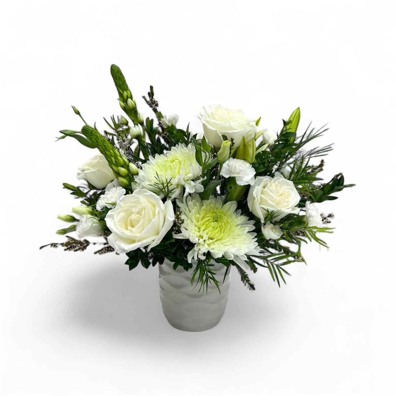 Bouquet of white and green flowers in a vase on a white background