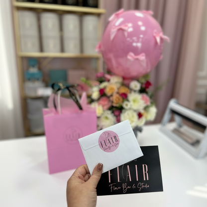 Flair Flower Bar & Studio branding with a pink balloon, flowers, and a pink gift bag.