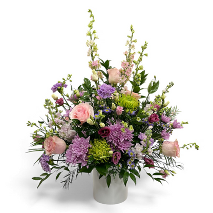Bouquet of flowers in a white vase on a white background