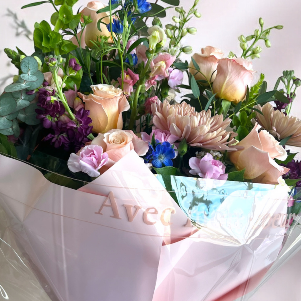 Bouquet of flowers with a pink wrap for Cincinnati delivery by Flair FLower Bar