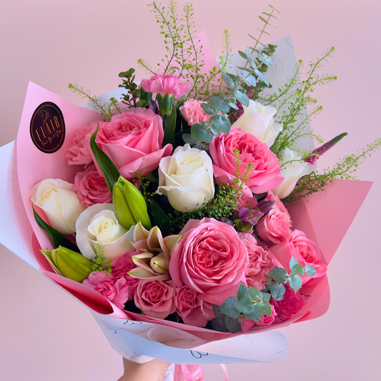 Bouquet of Pink and White Roses and florals wrapped in heart paper