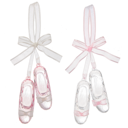 Two pairs of glass slipper ornaments with ribbons on a white background