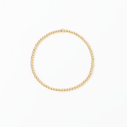 Gold bracelet on a white background