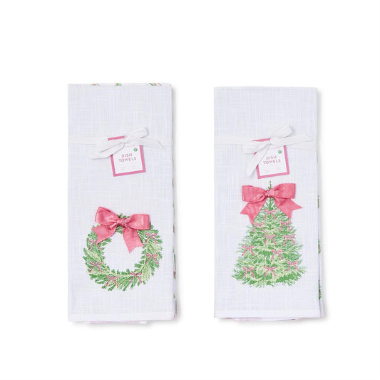 Two Christmas-themed towels with wreath and tree designs on a white background
