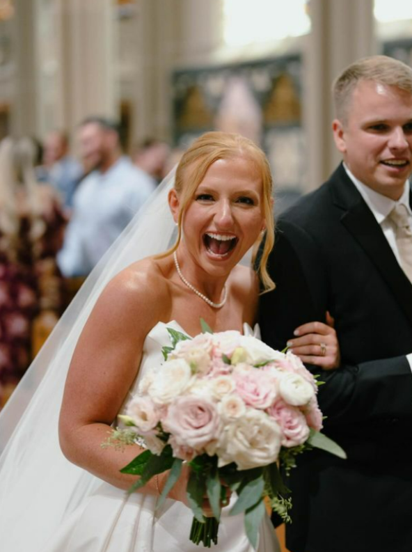 Bride holding a pastel pink and white bridal bouquet by Flair Flower Bar in Covington, Kentucky