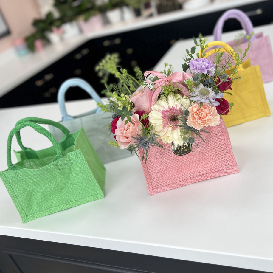 Colorful flower arrangement handbags in Cincinnati by Flair Flower Bar