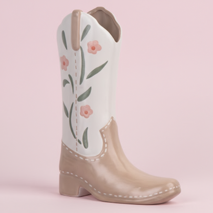 Ceramic vase cowboy boot with floral design on a pink background