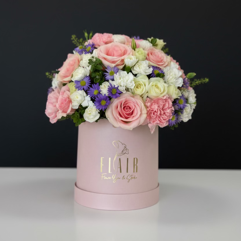 Floral arrangement in a pink box by Flair Flower Bar
