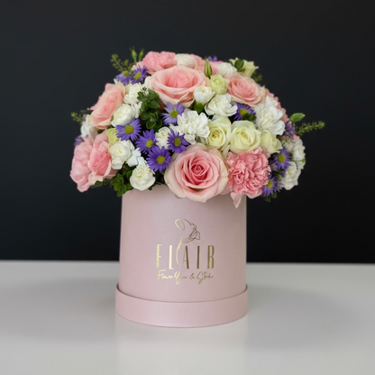 Floral arrangement in a pink box by Flair Flower Bar