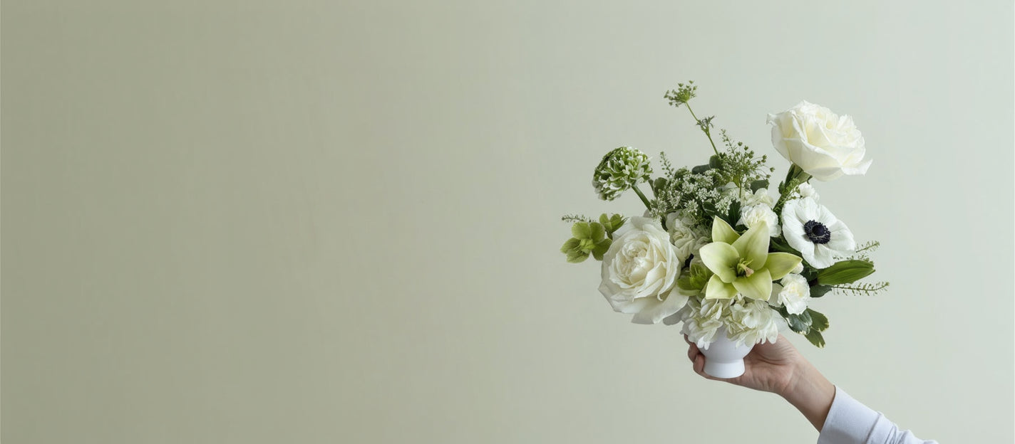 Flower Arrangement of white and green flowers designed by a Flair Flower Bar & Studio in Florence, Kentucky