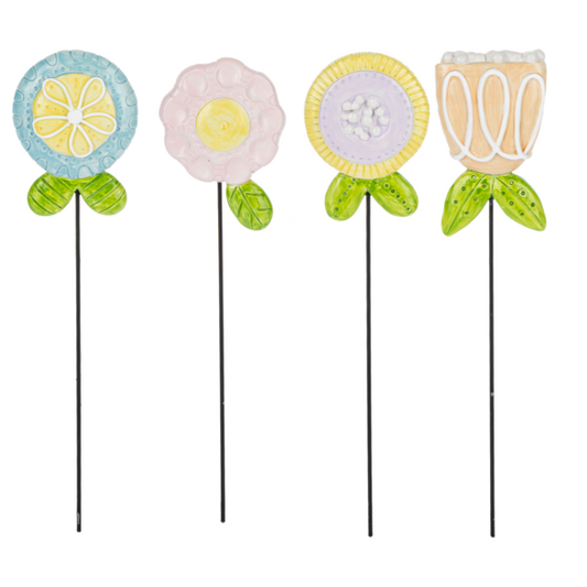 Four decorative garden sticks with colorful floral designs on a white background