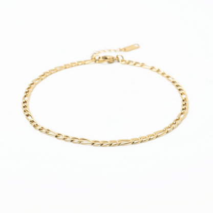 Gold chain anklet on a white background
