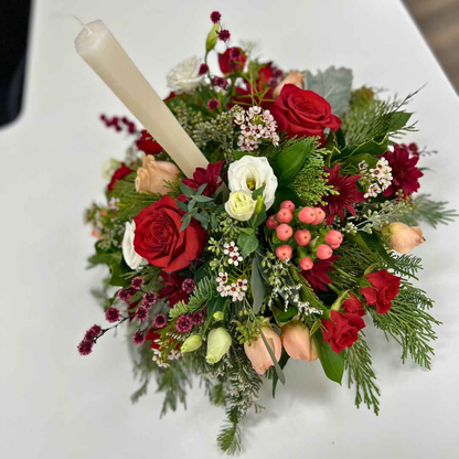 Elegant Christmas table centerpiece with red and white blooms