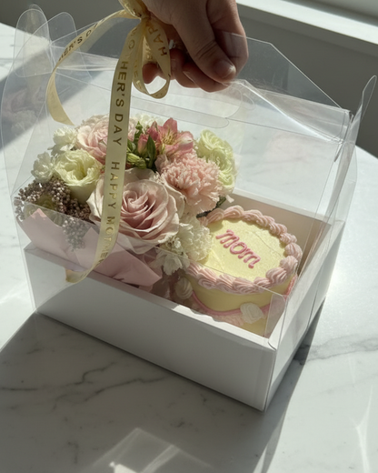 Mother's Day Gift box with flowers and a small cake labeled 'mom' on a marble surface, Florence Kentucky Delivery