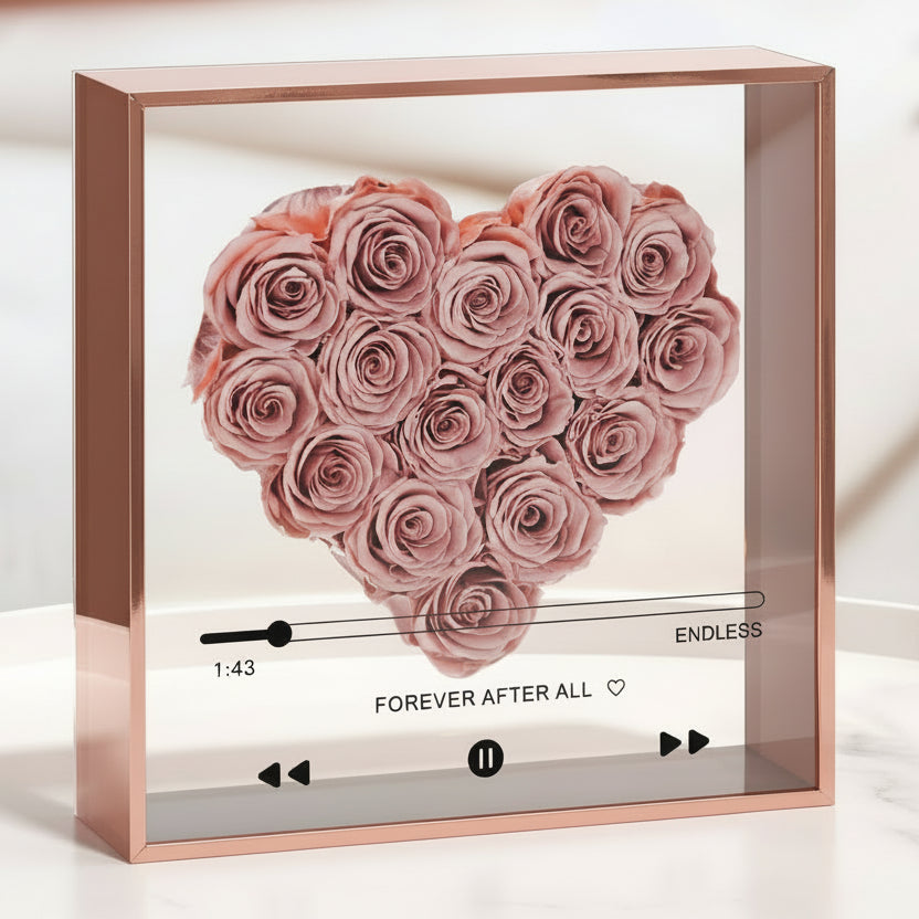 Heart-shaped frame with preserved roses on a table, available for local delivery or shipping nationwide by Flair Flower Bar & Studio