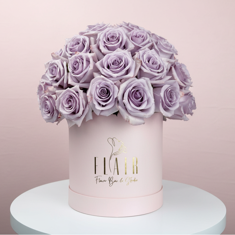 Pink flower box with lavender roses on a light pink background