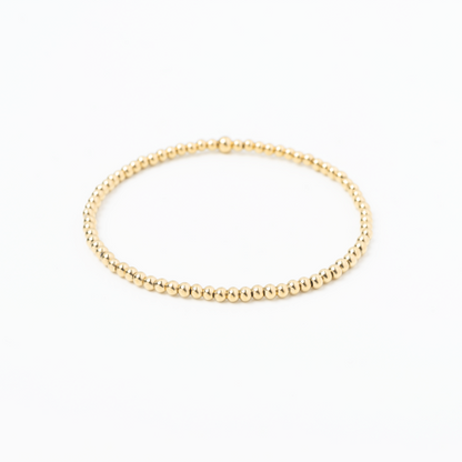 Gold bracelet on a white background