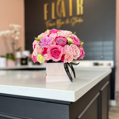 Pink Box of Flowers with shades of purple and pink flowers