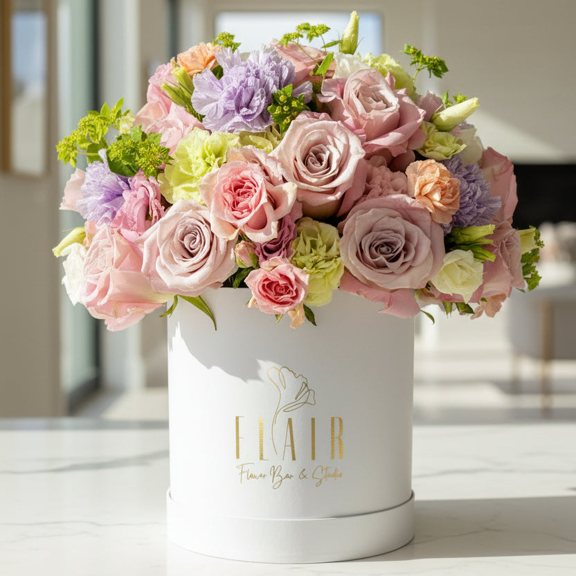 Floral arrangement in a white box with Flair Flower Bar branding in Florence, Kentucky