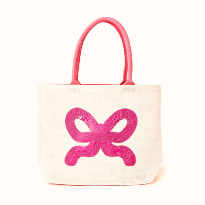 Tote bag with a pink bow design on a white background