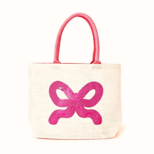 Tote bag with a pink bow design on a white background