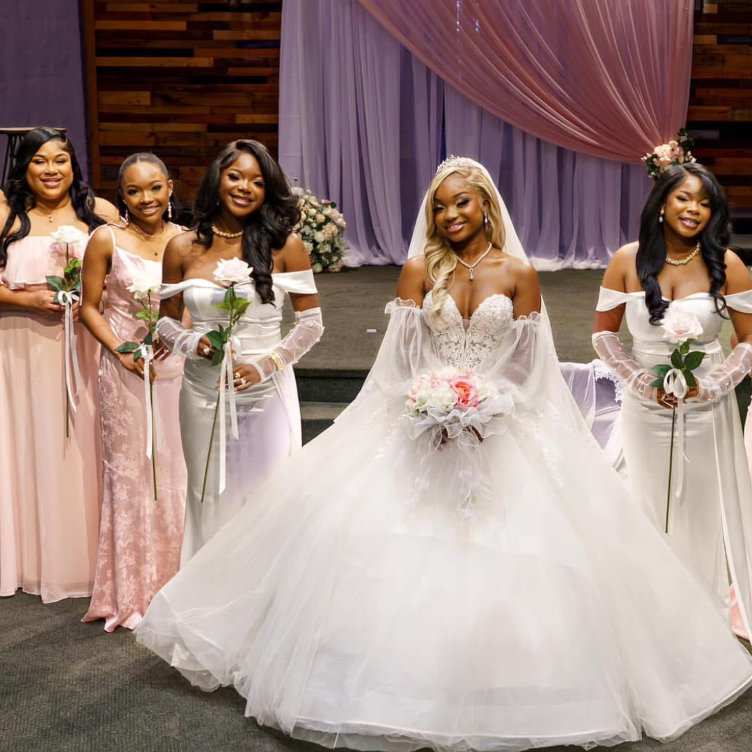 Bridesmaid bouquets with soft pink and white flowers tied with satin ribbons
