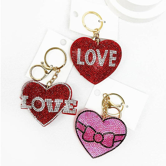 Heart-shaped keychains with 'LOVE' text on a white background