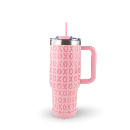 Pink tumbler with 'XOXO' pattern on a white background