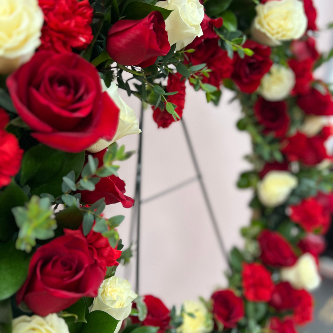 Funeral Wreath closeup view in red and white