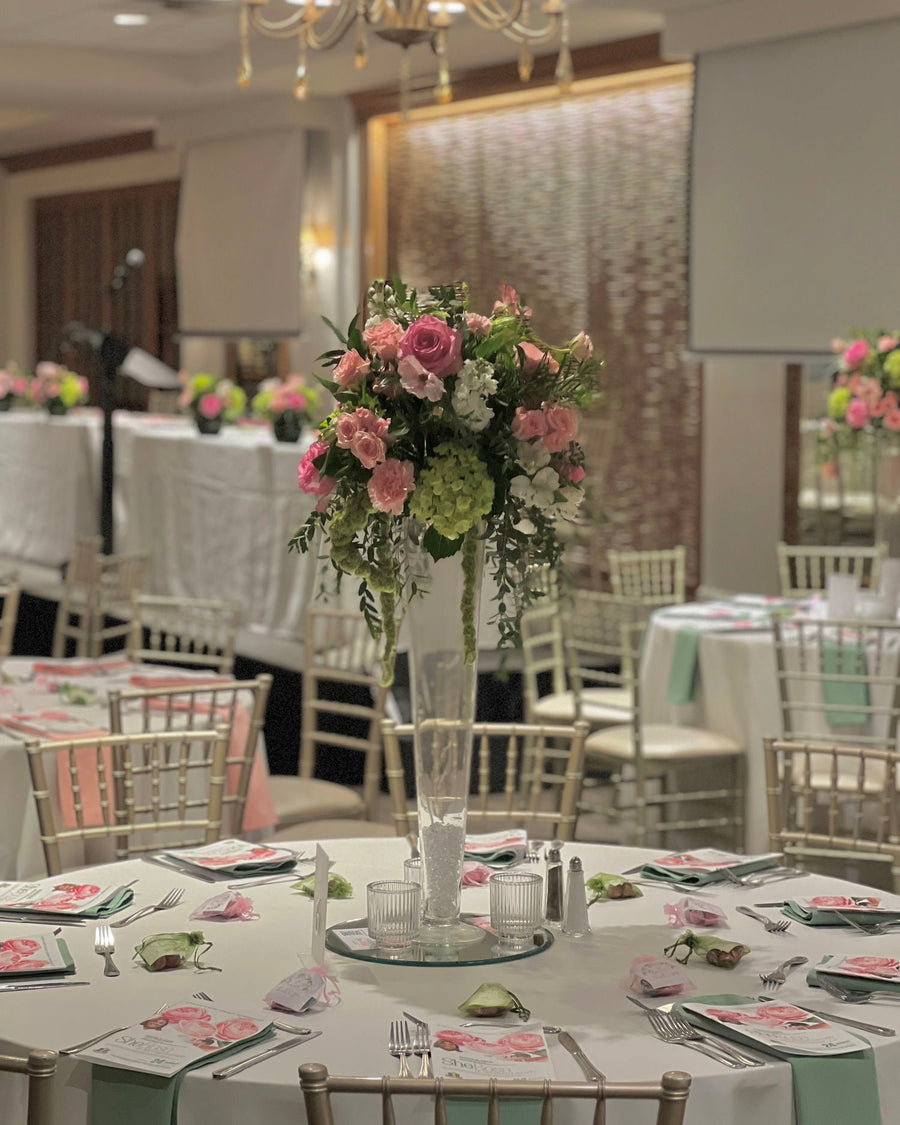 Reception tables with floral centerpieces by Flair Flower Bar at The Madison Event Center, Covington, Kentucky
