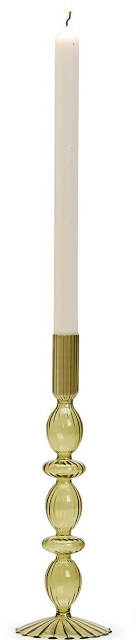 Green candle holder with a white candle on a white background