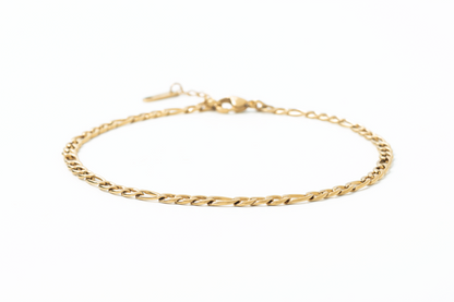 Gold chain anklet on a white background