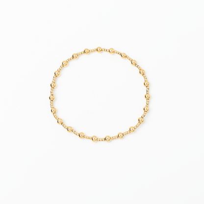 Gold bracelet on a white background
